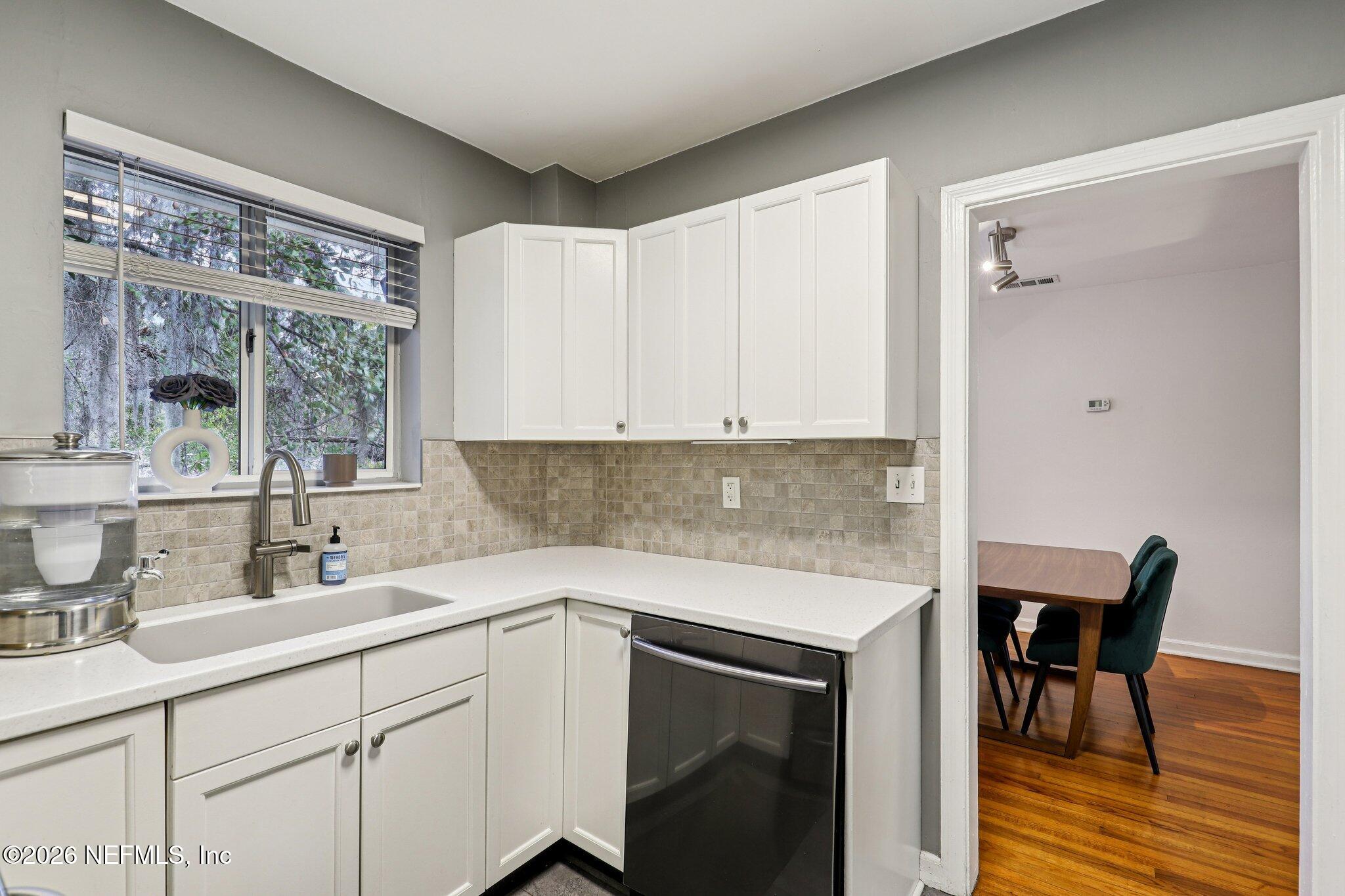 2159 Riverside Avenue, Unit 4 Jacksonville, FL 32204 - Photo 15 of 50 a kitchen with a sink cabinets and wooden floor