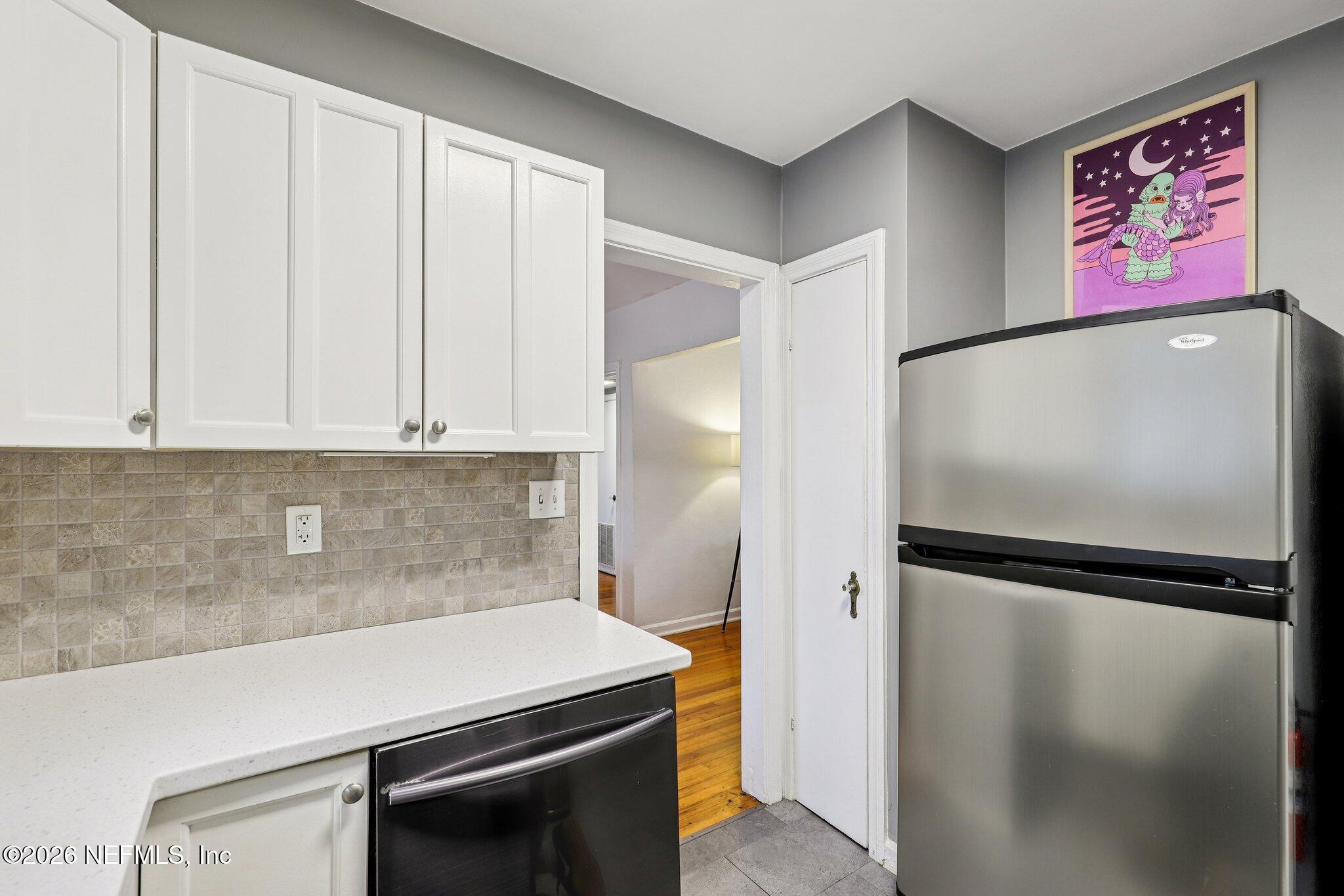 2159 Riverside Avenue, Unit 4 Jacksonville, FL 32204 - Photo 17 of 50 a kitchen with metallic refrigerator freezer and a dishwasher