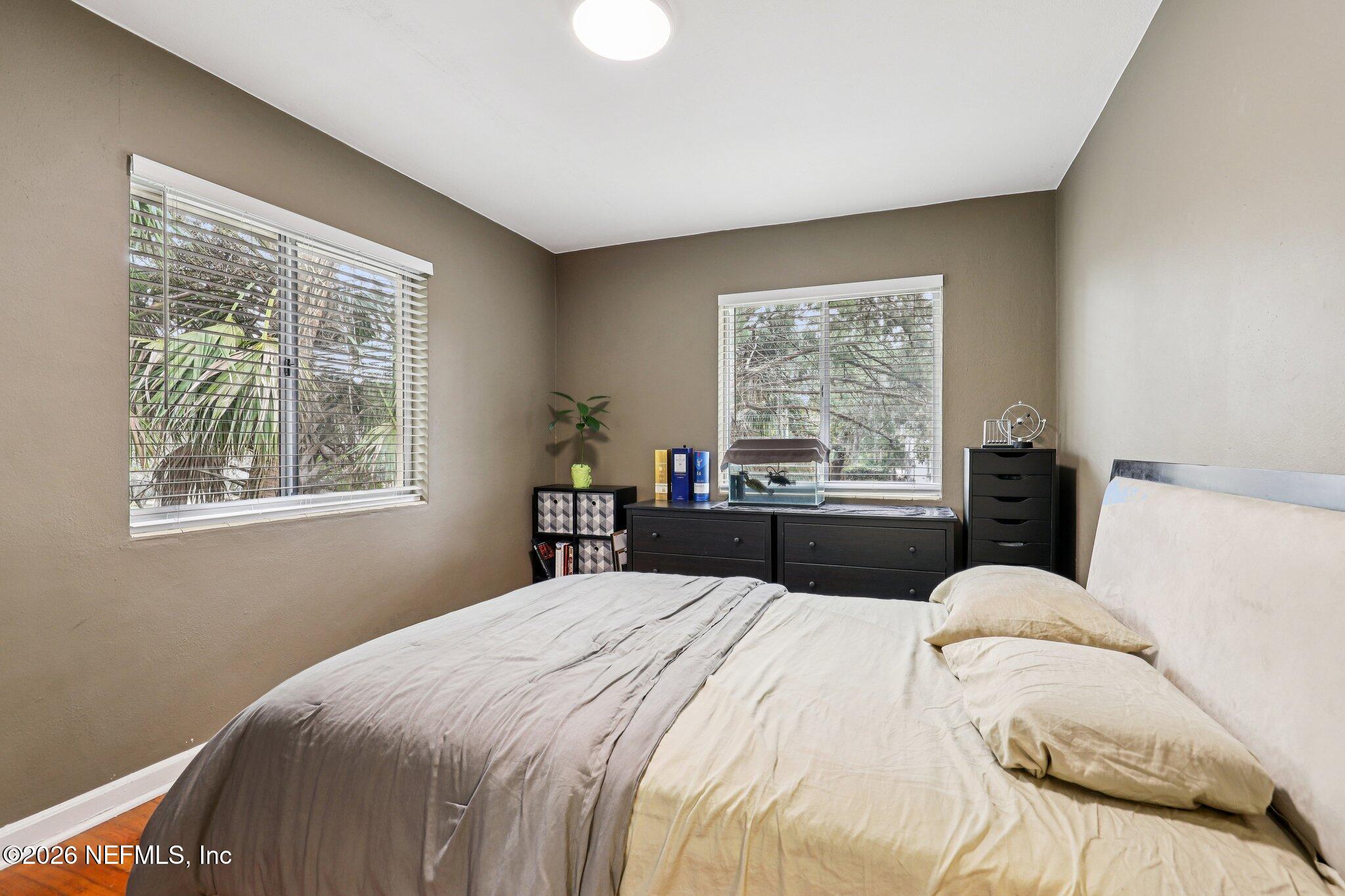 2159 Riverside Avenue, Unit 4 Jacksonville, FL 32204 - Photo 21 of 50 a bedroom with a bed and wooden floor