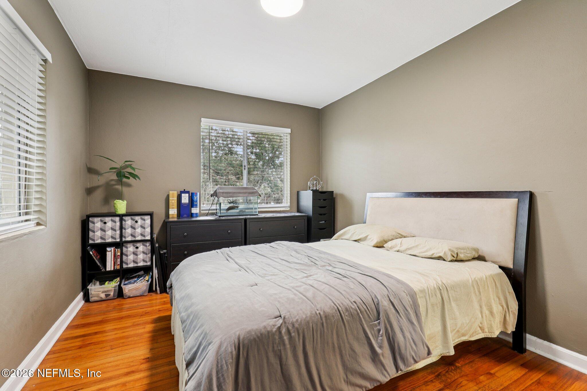 2159 Riverside Avenue, Unit 4 Jacksonville, FL 32204 - Photo 22 of 50 a bed sitting in a bedroom next to a window