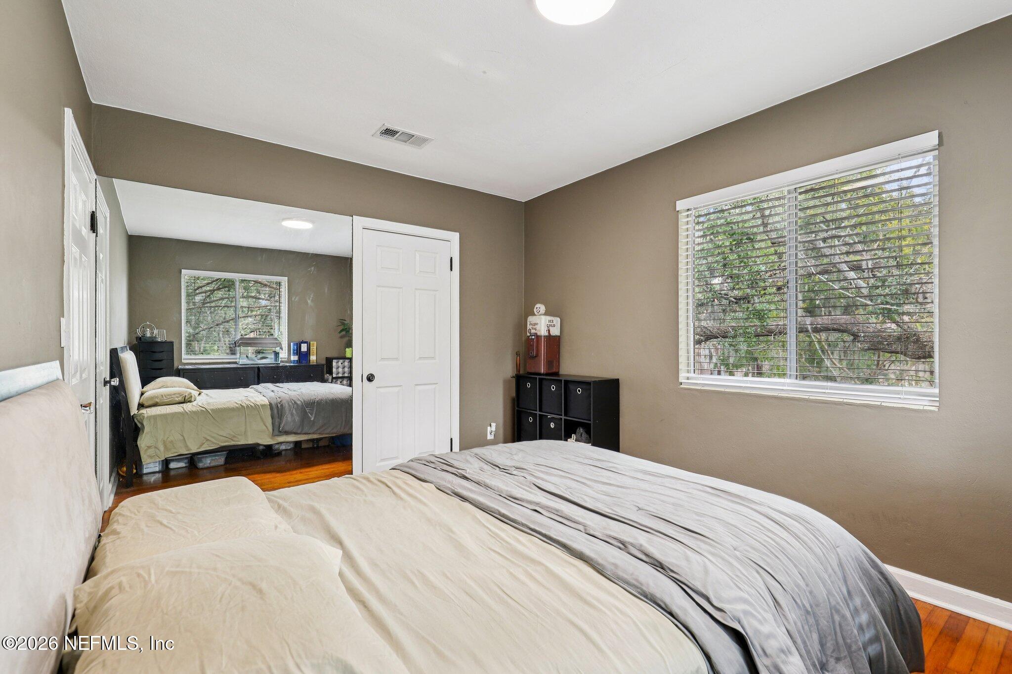 2159 Riverside Avenue, Unit 4 Jacksonville, FL 32204 - Photo 23 of 50 a bedroom with a bed and a large window