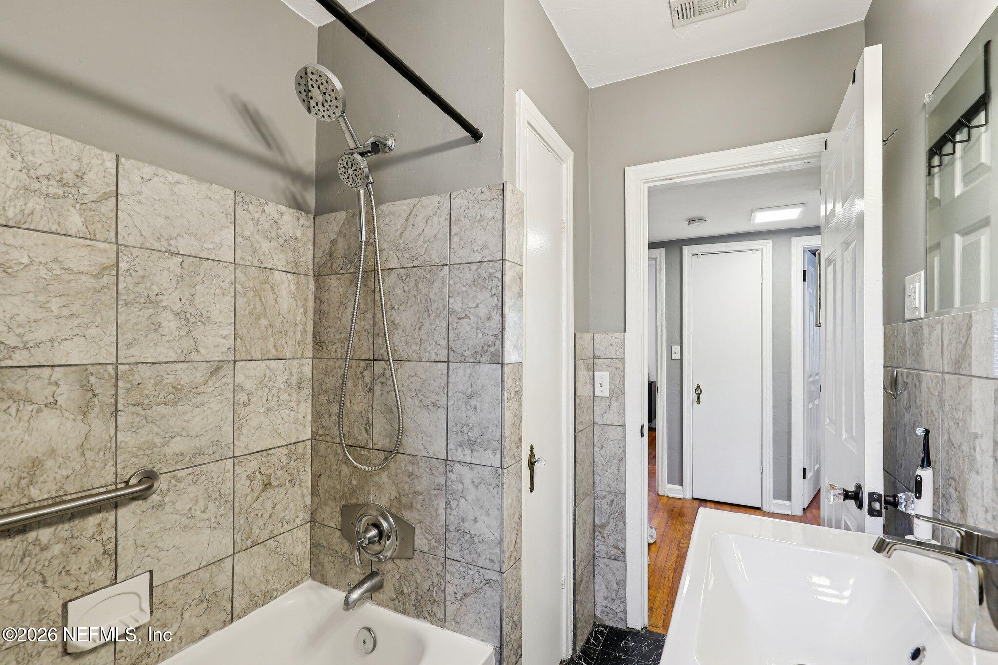 2159 Riverside Avenue, Unit 4 Jacksonville, FL 32204 - Photo 25 of 50 a bathroom with a sink and a shower