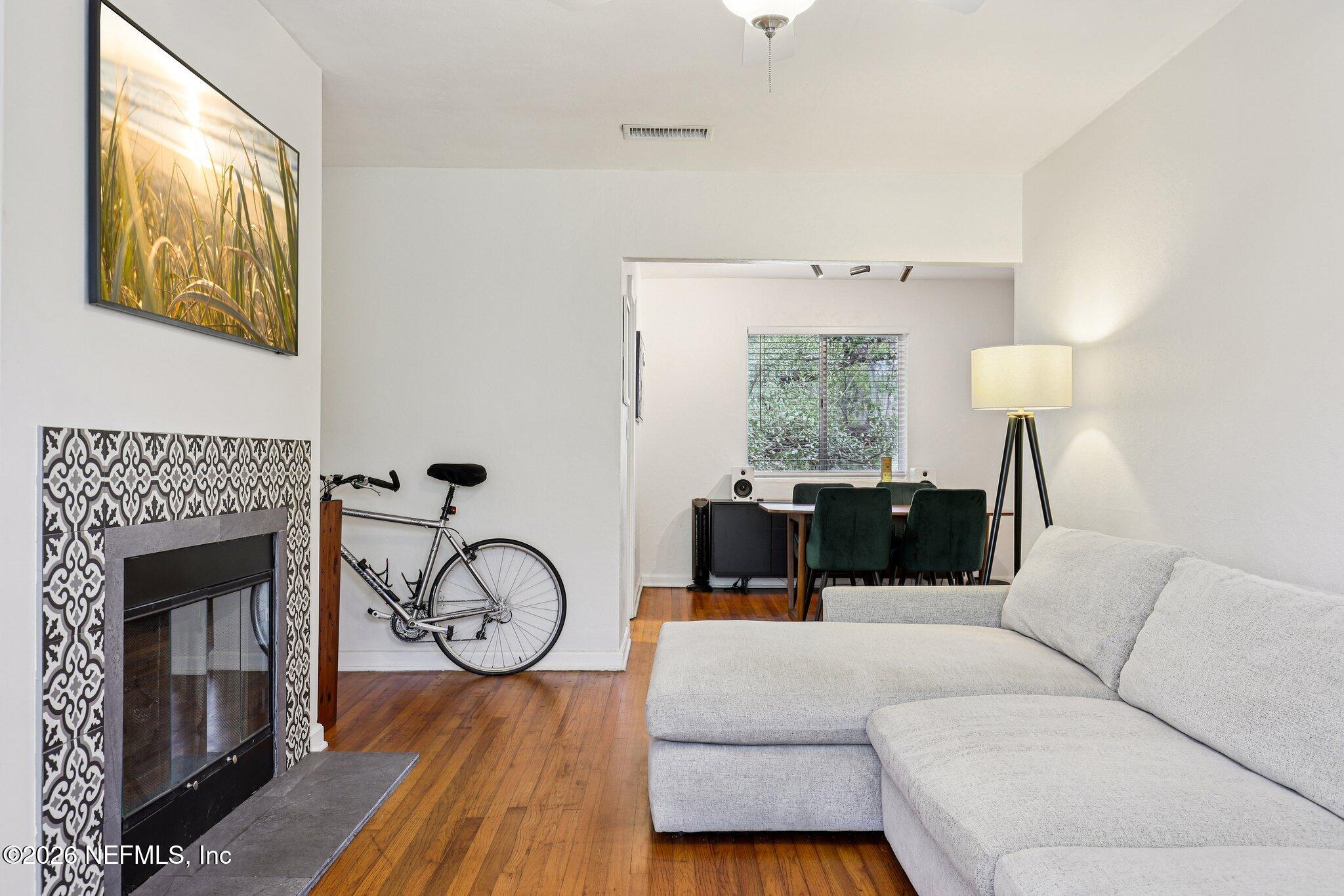 2159 Riverside Avenue, Unit 4 Jacksonville, FL 32204 - Photo 7 of 50 a living room with furniture a fireplace and wooden floor