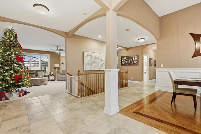 a view of a entryway dining room and hall with wooden floor