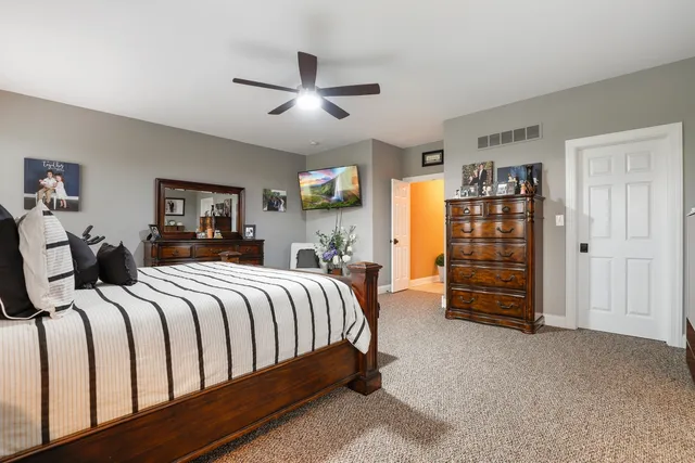 a bed room with a bed and a television