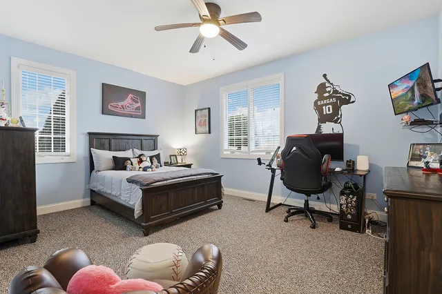 a bedroom with bed and a window