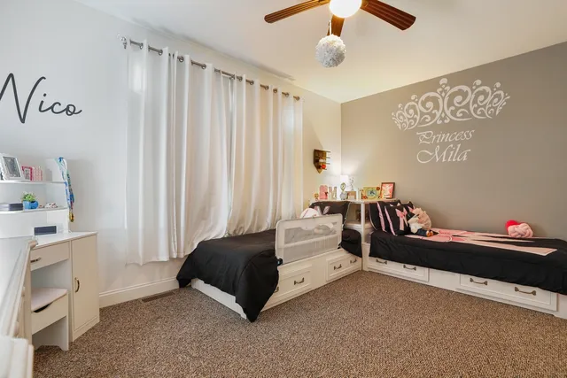 a bedroom with furniture and a chandelier