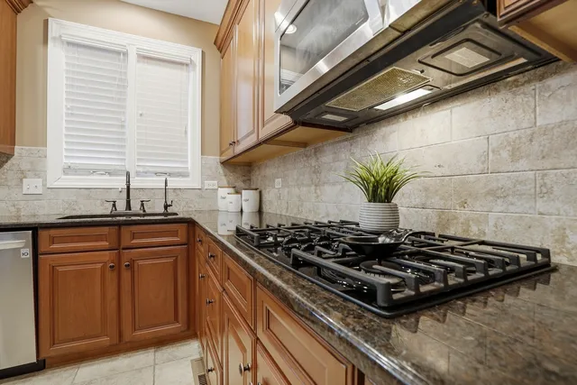 a kitchen with a stove and a sink