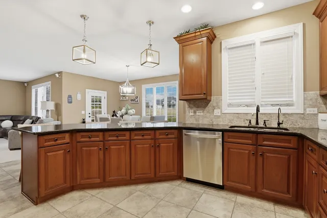 a kitchen with a sink and wooden cabinets