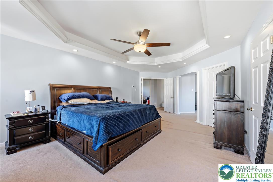 130 Lower Way Road Easton, PA 18045 - Photo 24 of 56 a bedroom with a bed and a chandelier