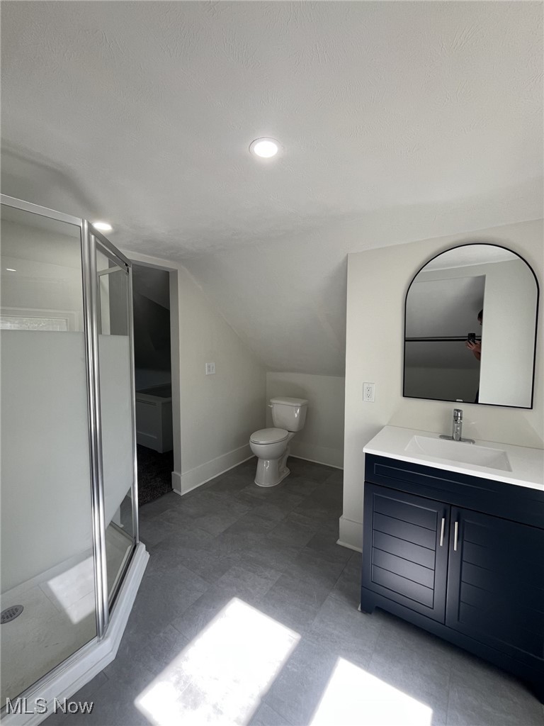 3264 Altamont Road Cleveland, OH 44118 - Photo 20 of 32 Bathroom with vanity, lofted ceiling, a stall shower, and a textured ceiling