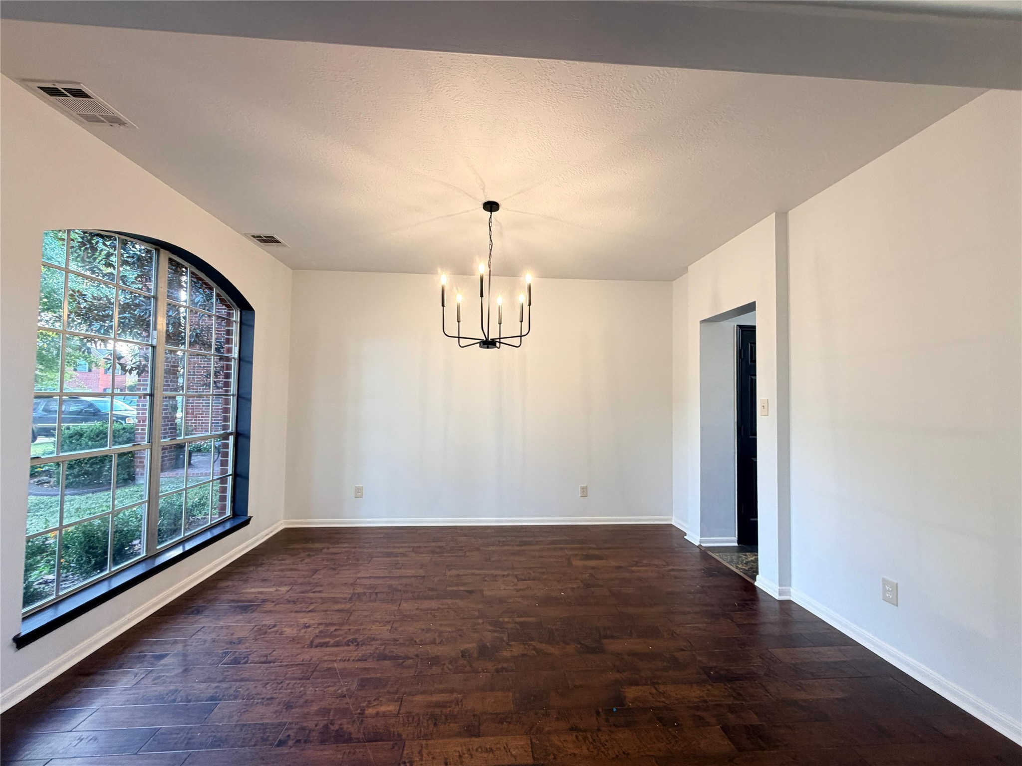 13002 Bainbridge Trail Houston, TX 77065 - Photo 16 of 32 wooden floor in an empty room with a window