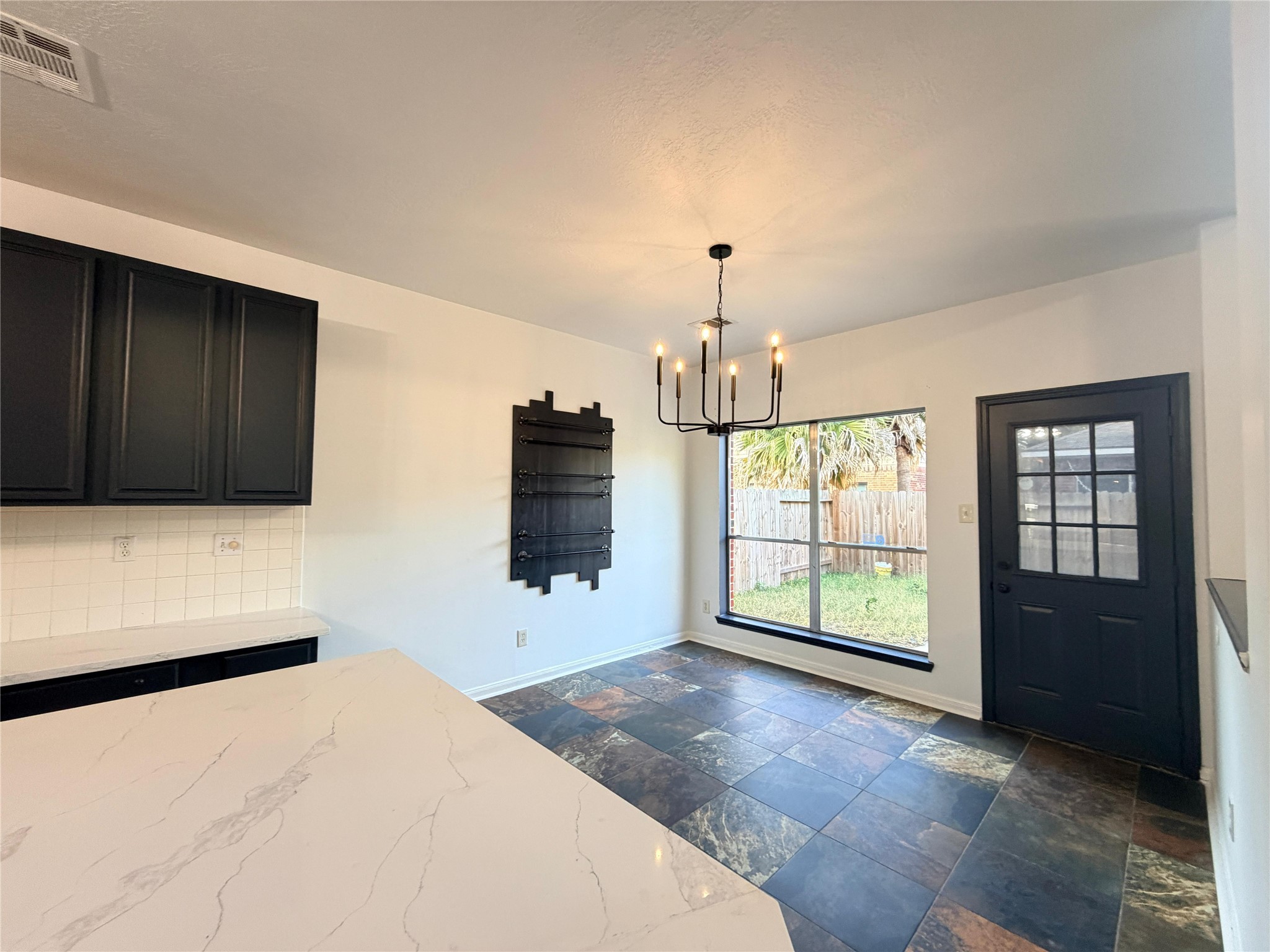 13002 Bainbridge Trail Houston, TX 77065 - Photo 19 of 32 a view of an empty room with a fireplace and a window