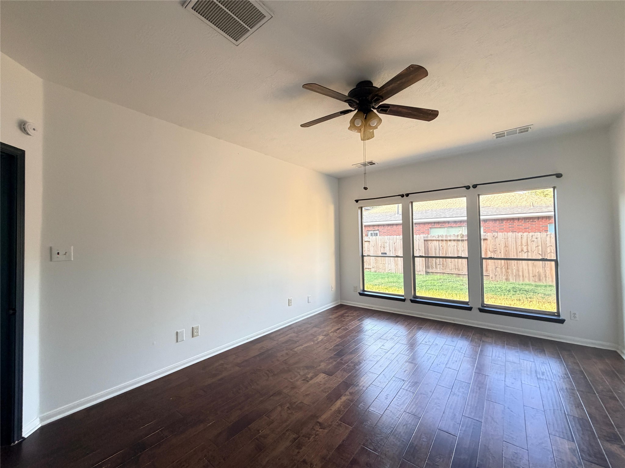 13002 Bainbridge Trail Houston, TX 77065 - Photo 20 of 32 wooden floor in an empty room with a window