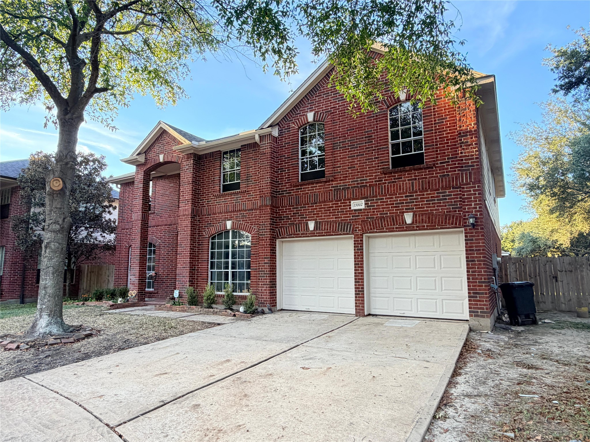 13002 Bainbridge Trail Houston, TX 77065 - Photo 2 of 32 a front view of a house with a yard