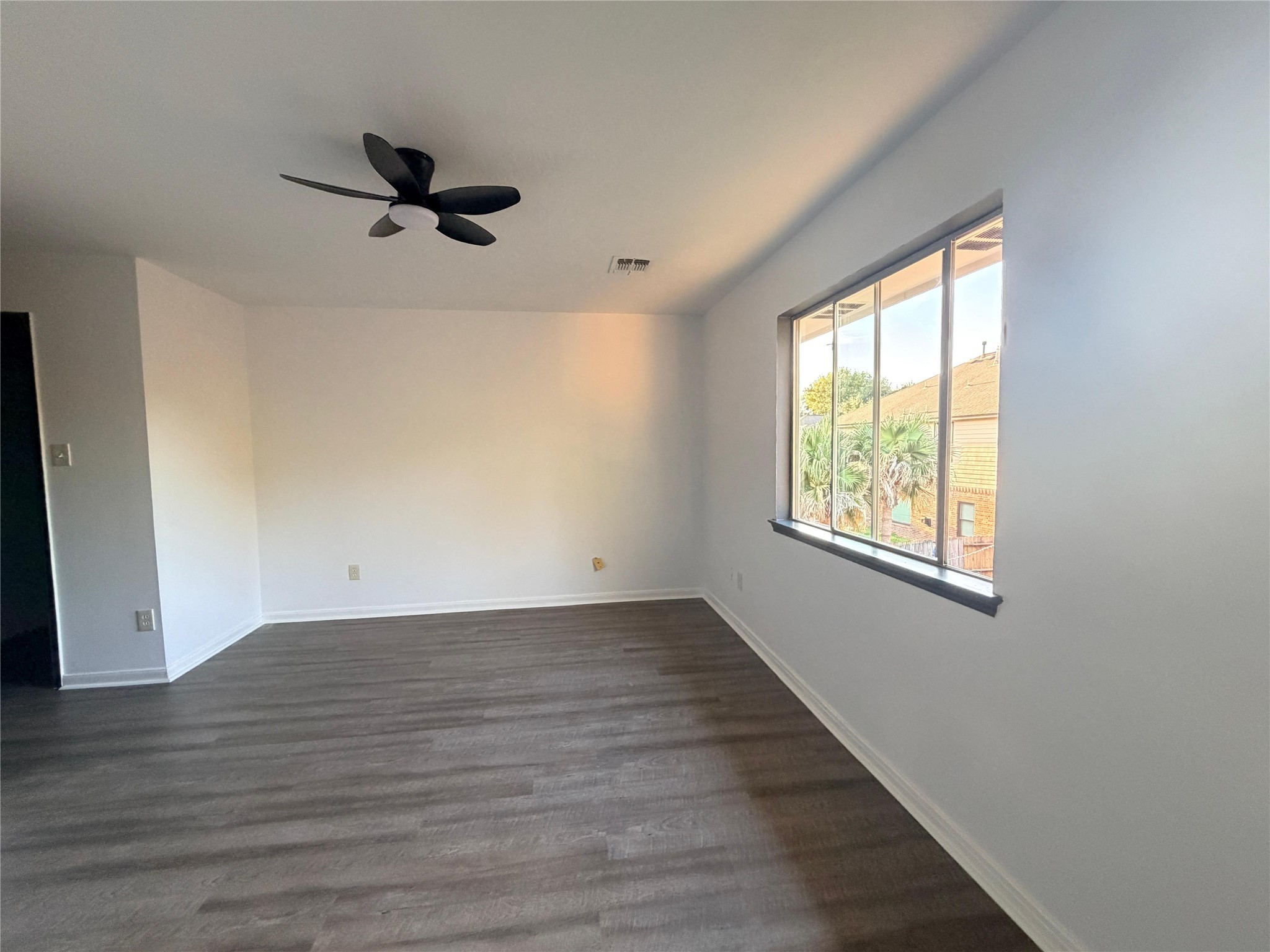 13002 Bainbridge Trail Houston, TX 77065 - Photo 25 of 32 a view of empty room with wooden floor and fan