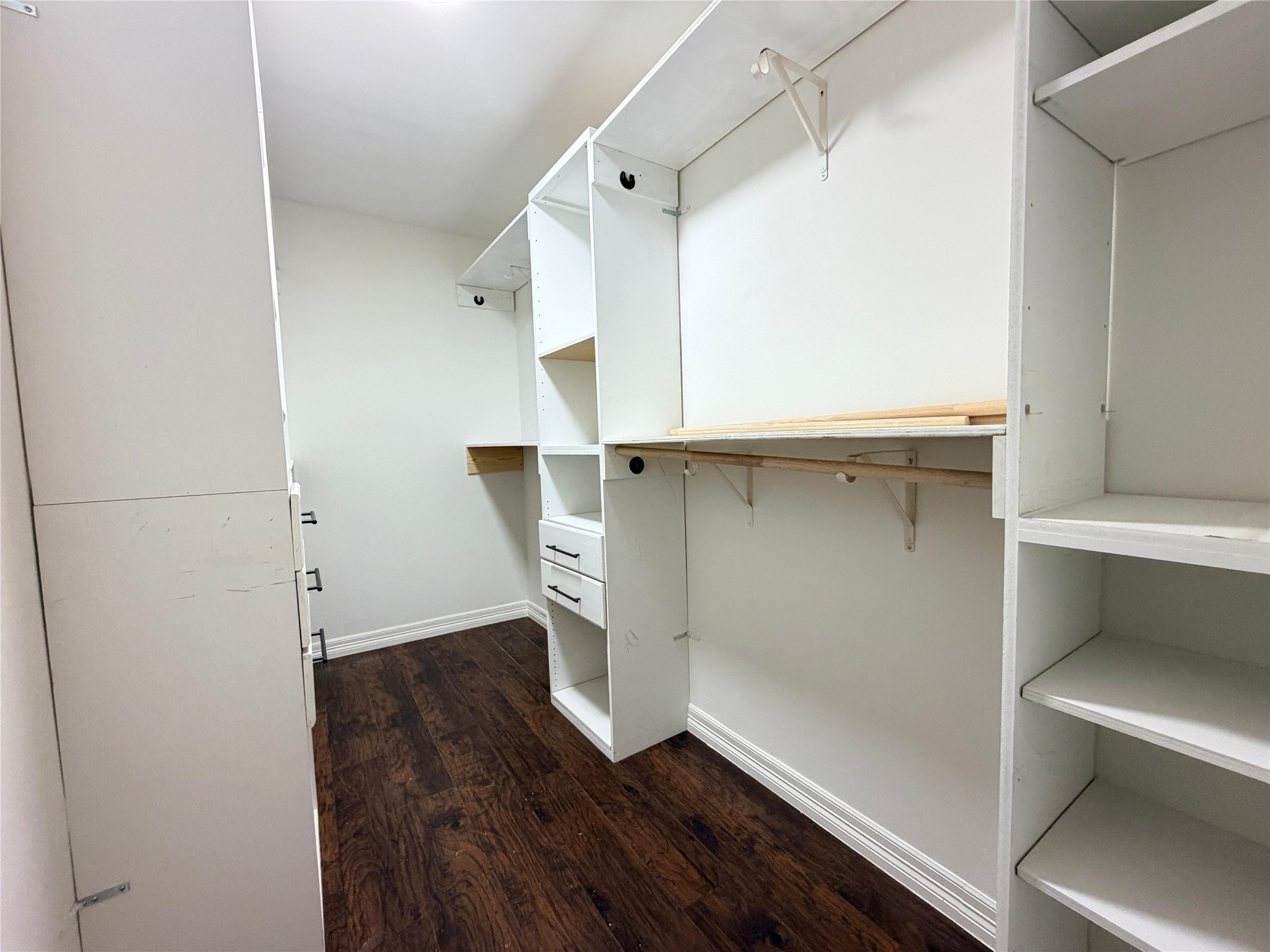 13002 Bainbridge Trail Houston, TX 77065 - Photo 30 of 32 a view of walk in closet with empty racks