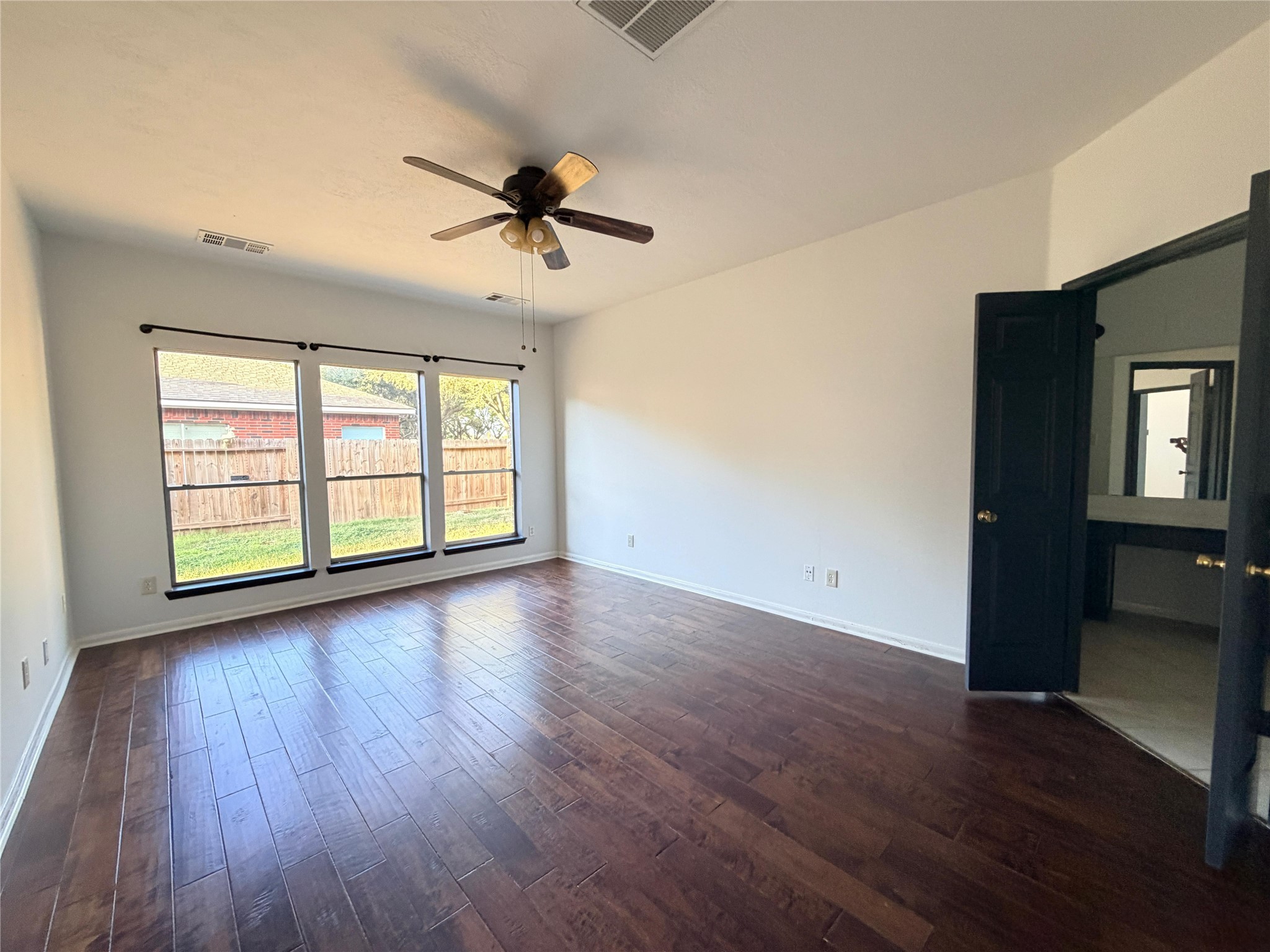 13002 Bainbridge Trail Houston, TX 77065 - Photo 32 of 32 wooden floor in an empty room with a window