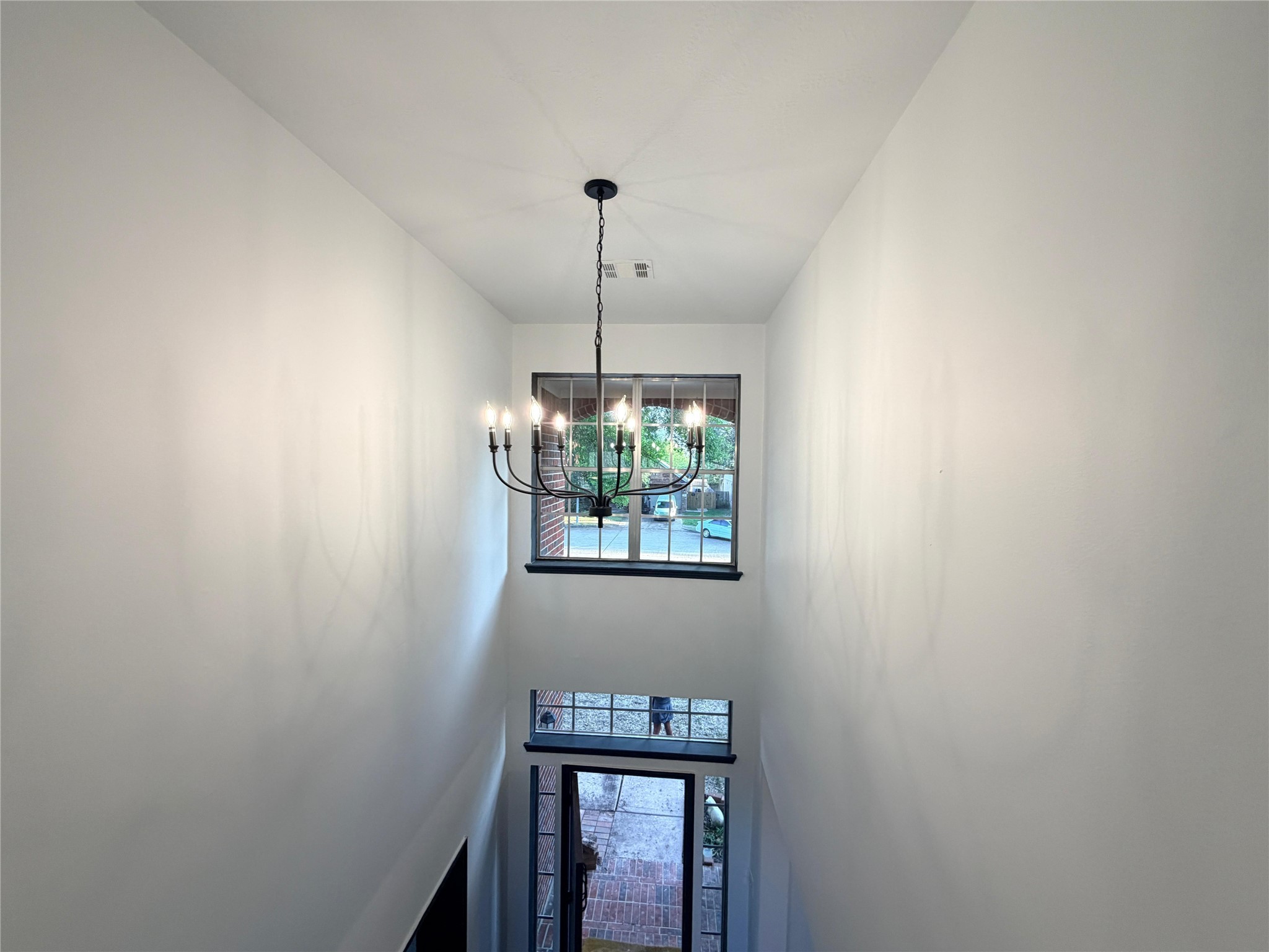 13002 Bainbridge Trail Houston, TX 77065 - Photo 7 of 32 a room with a window and a chandelier