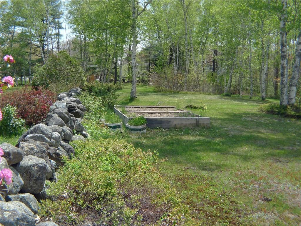 463 Wiscasset Road Boothbay, ME 04537 - Photo 19 of 19 Stone wall and lawn area