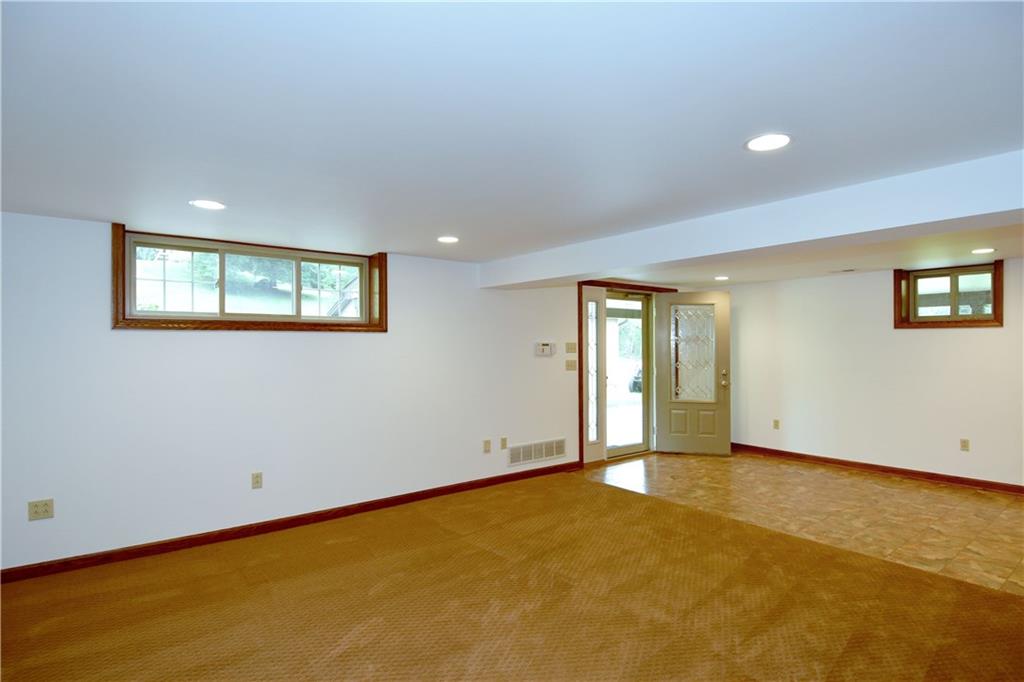 1585 Bellmonte Road Pittsburgh, PA 15237 - Photo 13 of 24 Large open lower level has tiled and carpeted areas.