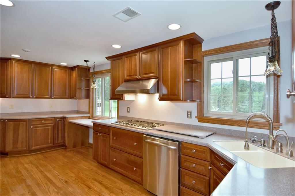 1585 Bellmonte Road Pittsburgh, PA 15237 - Photo 6 of 24 Fabulous, totally remodeled kitchen with Wellborn solid cherry cabinetry, under cabinet lighting & LG Hi-Macs solid-surface, color-through counter tops.