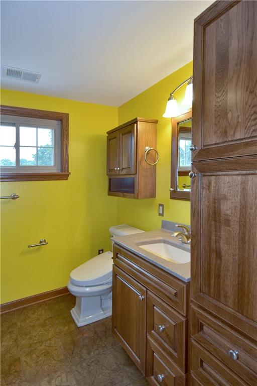 1585 Bellmonte Road Pittsburgh, PA 15237 - Photo 10 of 24 Upgrade hall bath on the main floor has Feel Fresh commode with heated bidet seat and LG Hi-Macs solid surface, color-through counter top.
