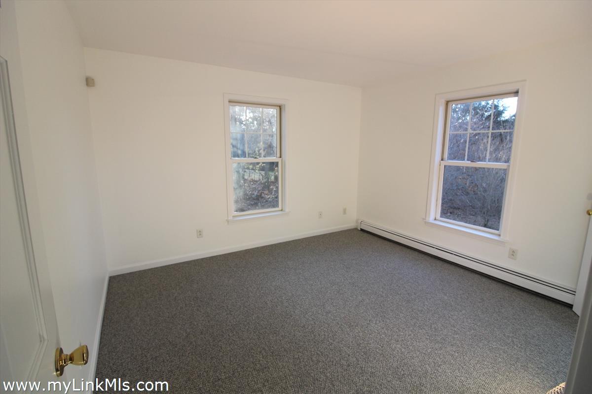 11 Flamingo Drive Edgartown, MA 02539 - Photo 11 of 25 an empty room with windows