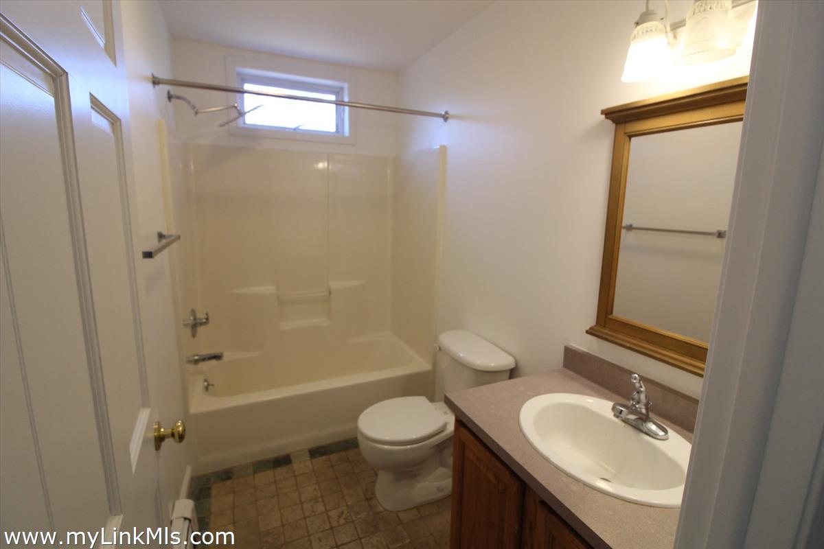 11 Flamingo Drive Edgartown, MA 02539 - Photo 14 of 25 a bathroom with a sink a toilet and shower