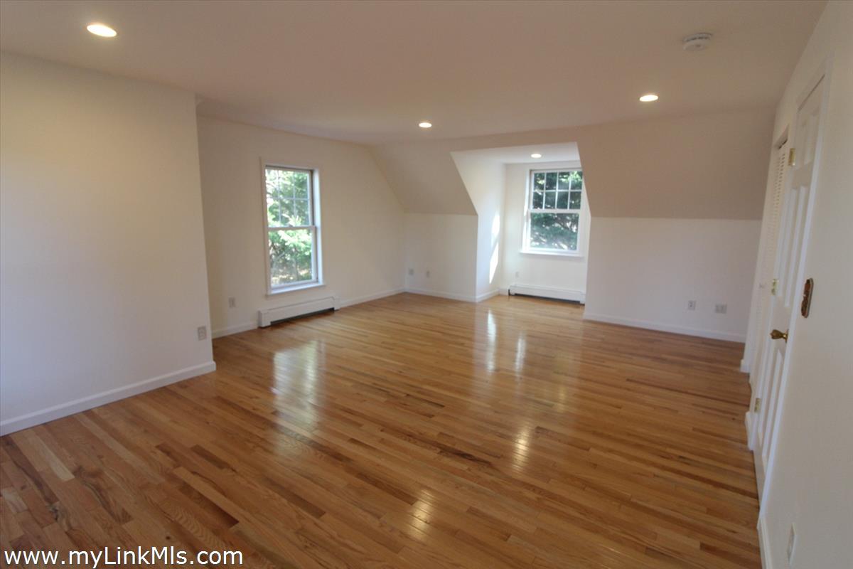 11 Flamingo Drive Edgartown, MA 02539 - Photo 17 of 25 a view of an empty room with wooden floor and a window