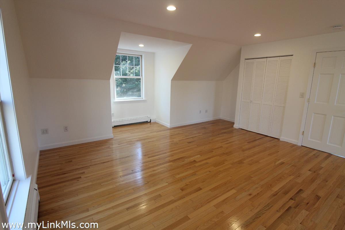 11 Flamingo Drive Edgartown, MA 02539 - Photo 18 of 25 a view of an empty room with wooden floor and a window