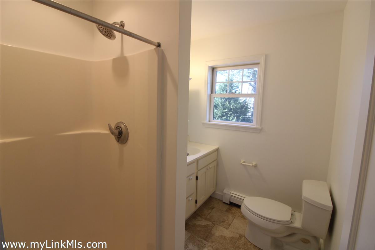 11 Flamingo Drive Edgartown, MA 02539 - Photo 22 of 25 a white toilet sitting next to a shower