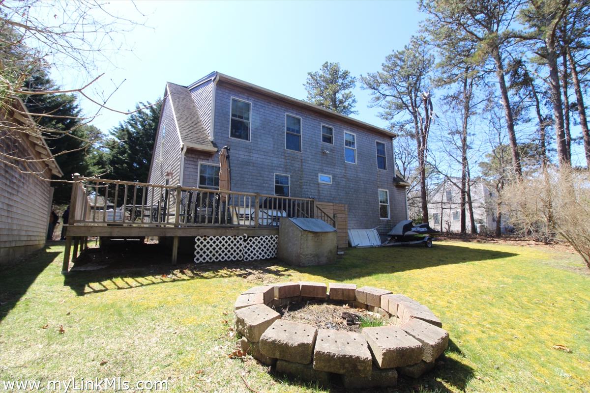 11 Flamingo Drive Edgartown, MA 02539 - Photo 3 of 25 a front view of a house with swimming pool
