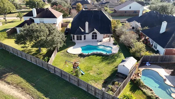 an aerial view of a house with a ocean view