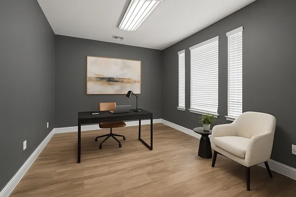 a workspace with furniture and a window