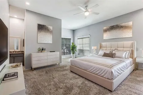 a bedroom with a bed and a couch