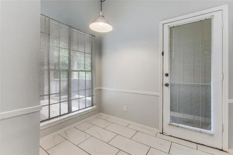 a view of an empty room and window