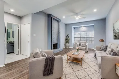 a living room with furniture and a table