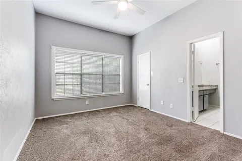 an empty room with a empty space and windows