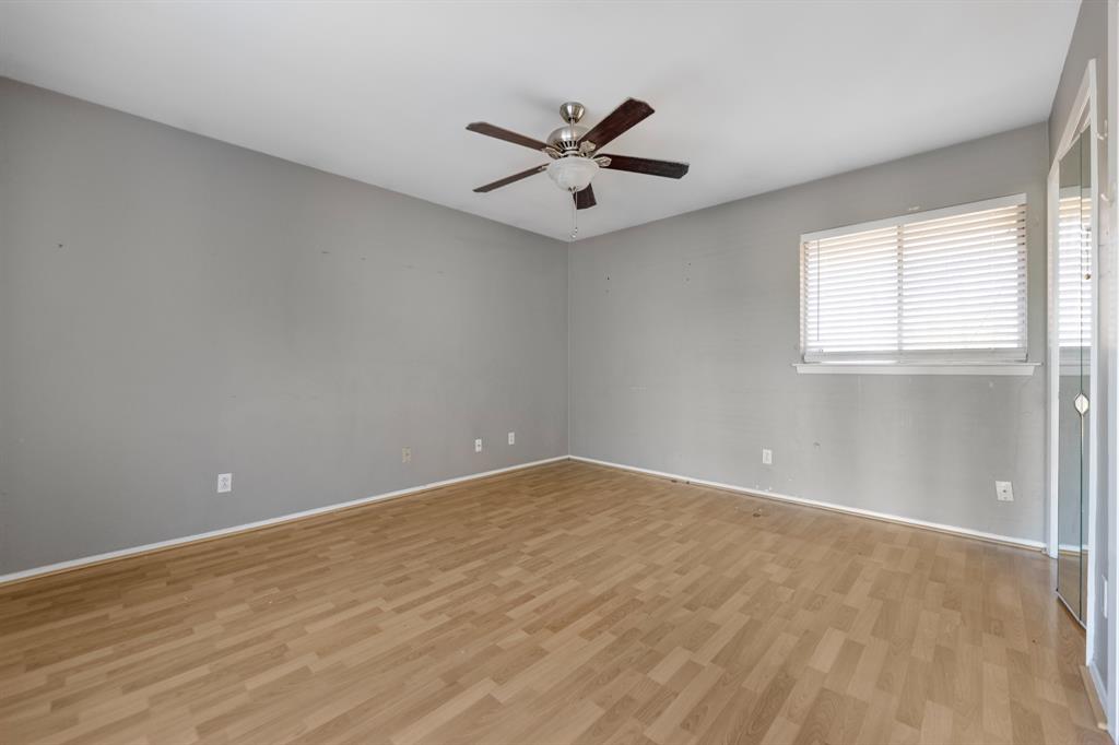 518 Worcester Way Richardson, TX 75080 - Photo 24 of 35 wooden floor in an empty room with a window