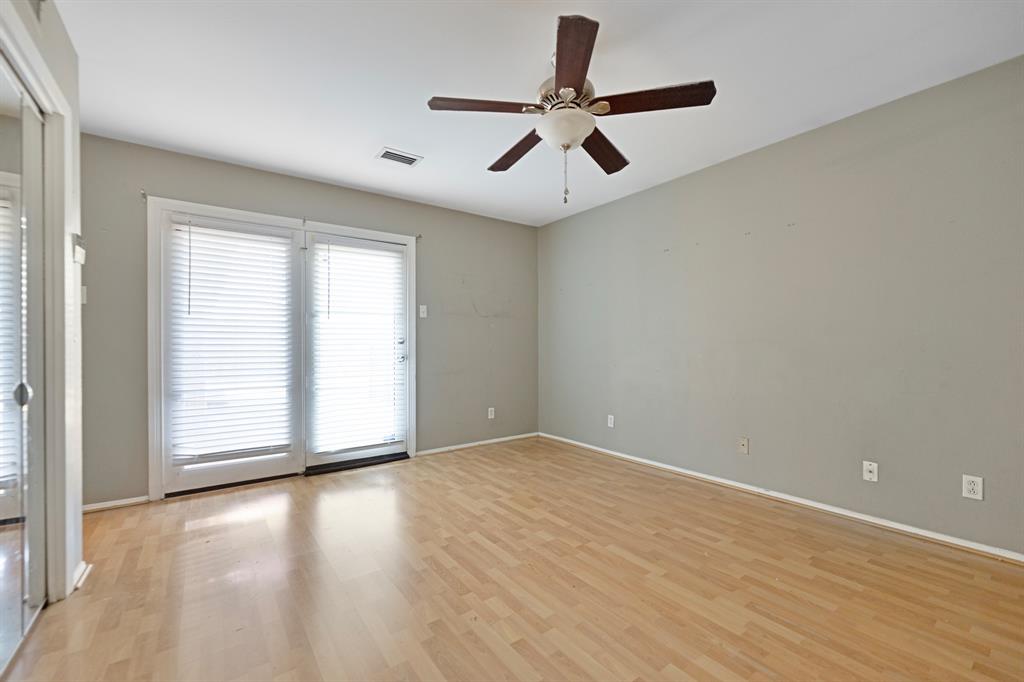 518 Worcester Way Richardson, TX 75080 - Photo 25 of 35 an empty room with wooden floor fan and windows