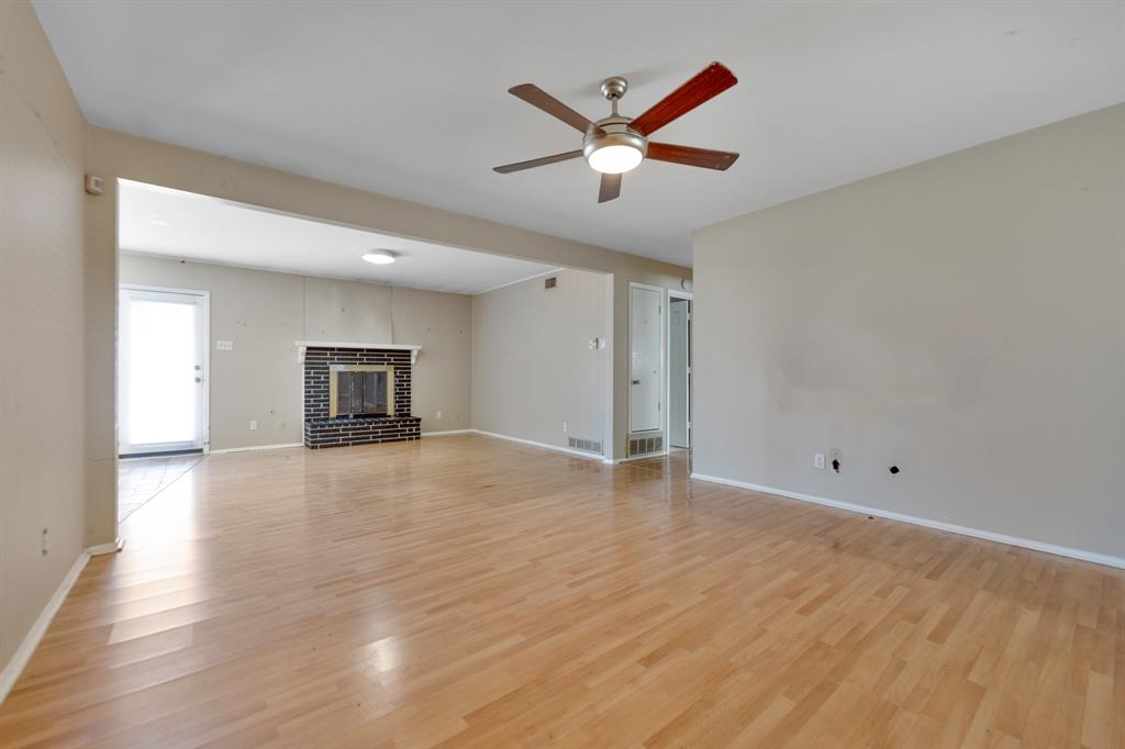 518 Worcester Way Richardson, TX 75080 - Photo 6 of 35 a view of empty room with wooden floor and ceiling fan