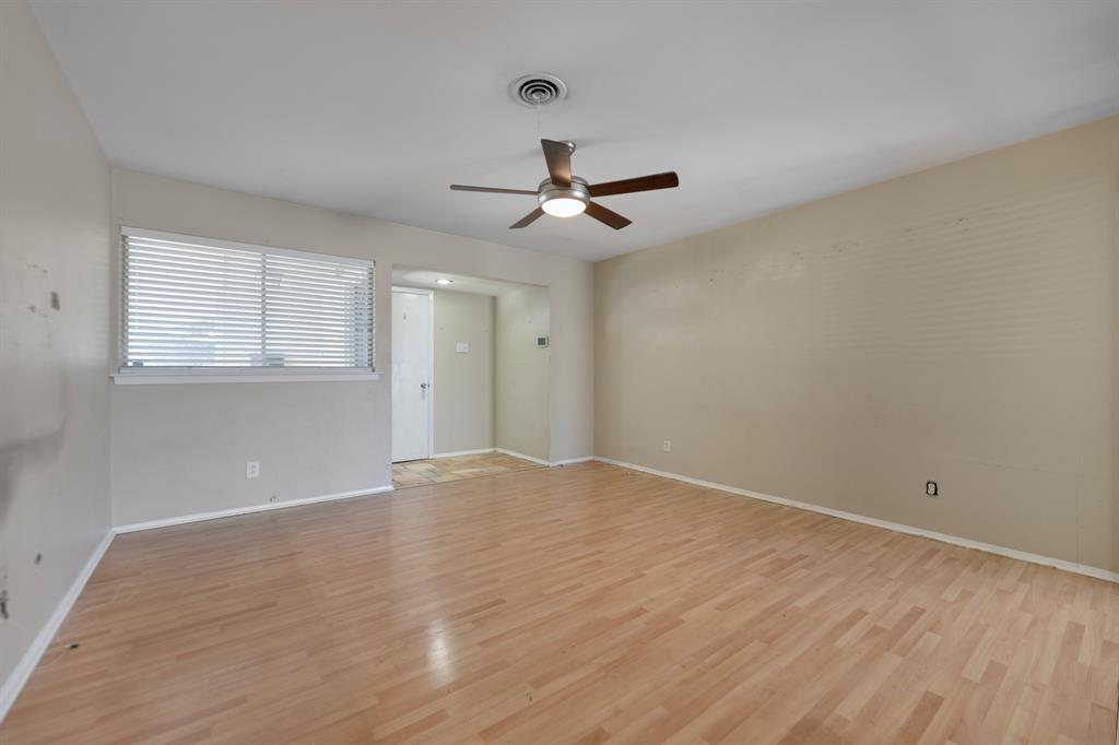 518 Worcester Way Richardson, TX 75080 - Photo 8 of 35 wooden floor in an empty room with a window