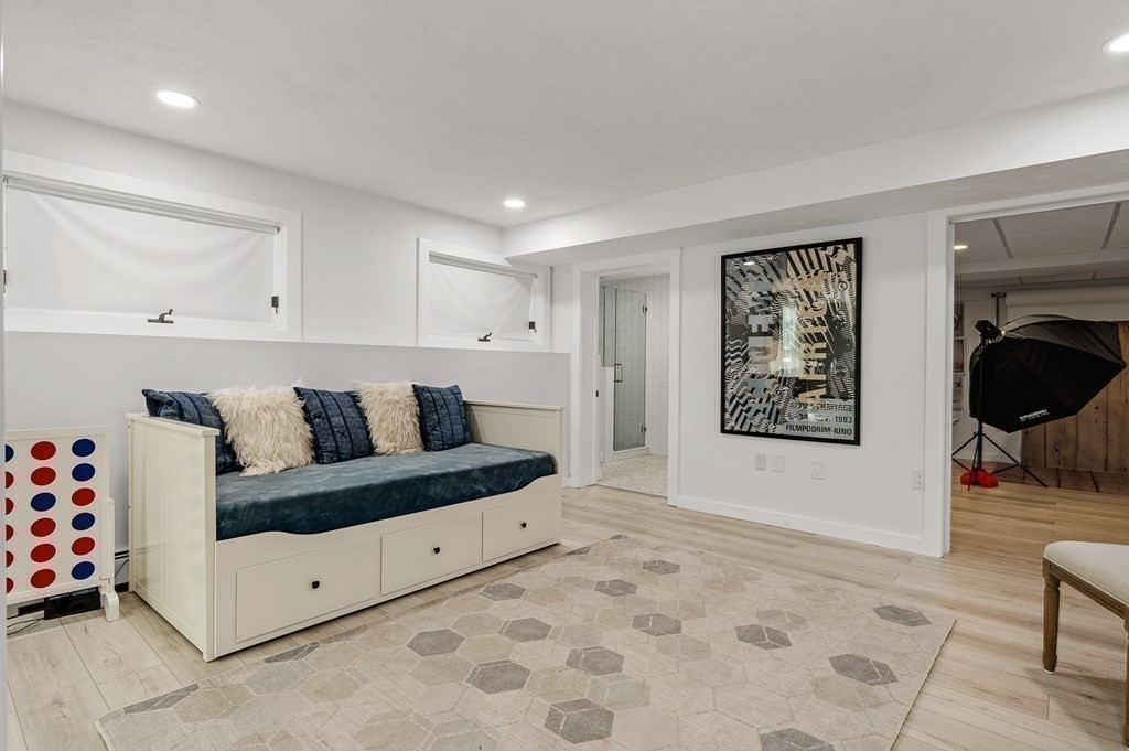 154 Harvard Road Stow, MA 01775 - Photo 25 of 42 a living room with furniture and a fireplace
