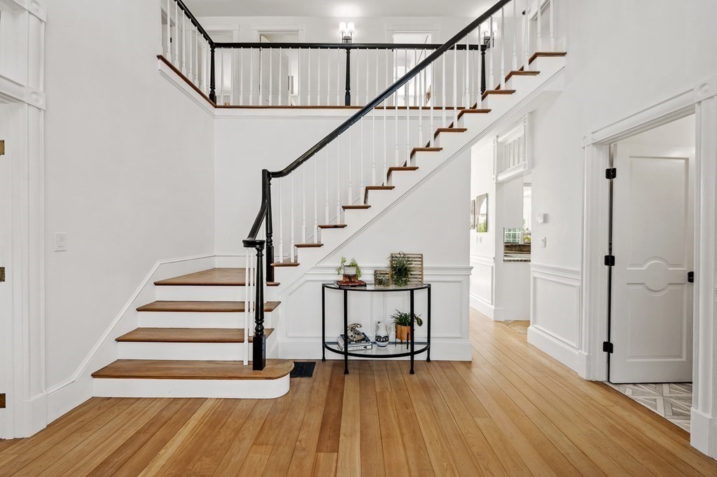 154 Harvard Road Stow, MA 01775 - Photo 4 of 42 a view of entryway with wooden floor and stairs