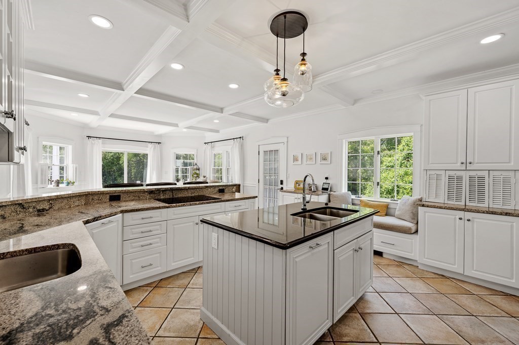 154 Harvard Road Stow, MA 01775 - Photo 6 of 42 a kitchen with white cabinets and appliances