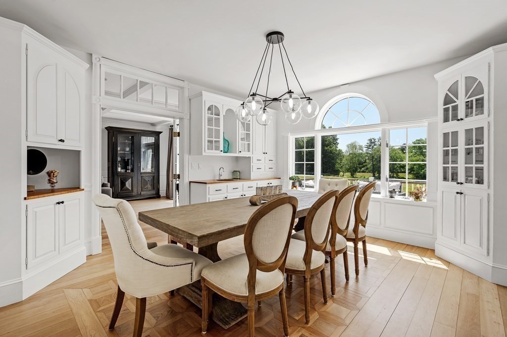 154 Harvard Road Stow, MA 01775 - Photo 8 of 42 a view of a dining room with furniture window and wooden floor