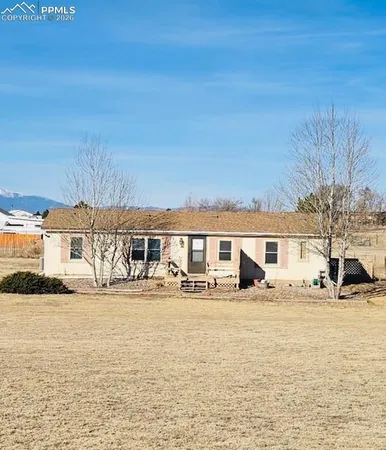 a view of a building with a yard