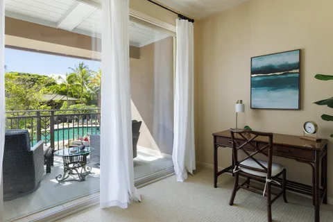 a view of a livingroom with furniture and a window