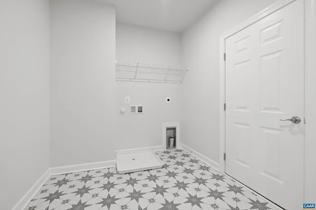 a bedroom with a large bed and windows